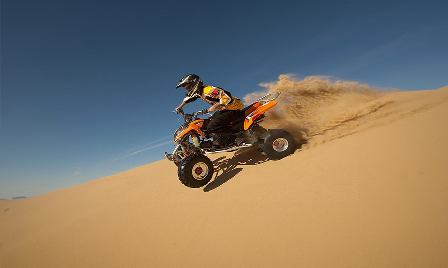 Powerful quad bike tracks across Dubai desert